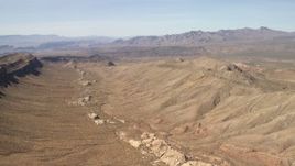 4K aerial stock footage flyby a wide canyon between mountains in the Arizona Desert Aerial Stock Footage | FG0001_000251