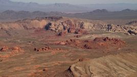4K aerial stock footage of red rock formations near a mountain ridge in the Nevada Desert Aerial Stock Footage | FG0001_000258