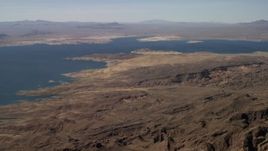 4K aerial stock footage of a view of Lake Mead seen from the rugged desert shore, Nevada Aerial Stock Footage | FG0001_000279