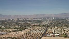 4K aerial stock footage of Las Vegas hotels and casinos seen from suburban neighborhoods, Nevada Aerial Stock Footage | FG0001_000308