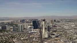 4K aerial stock footage flyby Stratosphere with a view of hotels and casinos on the Las Vegas Strip in Nevada Aerial Stock Footage | FG0001_000318