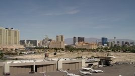 4K aerial stock footage of lifting off from McCarran Airport to focus on casino resorts on the Las Vegas Strip, Nevada Aerial Stock Footage | FG0001_000333