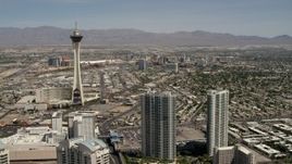 4K aerial stock footage approach Stratosphere with Downtown Las Vegas casinos in the background, Nevada Aerial Stock Footage | FG0001_000339