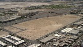4K aerial stock footage future site of the Las Vegas Raiders stadium beside I-15 with light traffic in Las Vegas, Nevada Aerial Stock Footage | FG0001_000350