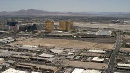 4K aerial stock footage of an open dirt lot beside I-15 with light traffic in Las Vegas, Nevada and casino resorts on the Strip Aerial Stock Footage | FG0001_000352