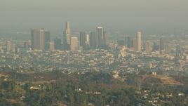 HD stock footage aerial video Downtown Los Angeles skyline seen from the Hollywood Hills, California, sunset Aerial Stock Footage | HDA06_03