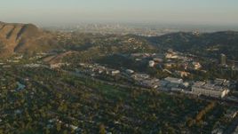 HD stock footage aerial video Universal Studios Hollywood and Downtown Los Angeles skyline, Universal City, California, sunset Aerial Stock Footage | HDA06_04