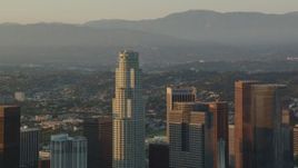 HD stock footage aerial video orbit US Bank Tower, zoom to reveal the rest of Downtown Los Angeles at sunset, California Aerial Stock Footage | HDA06_24