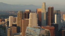 HD stock footage aerial video flying by the skyscrapers of Downtown Los Angeles at sunset, California Aerial Stock Footage | HDA06_27