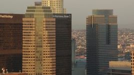 HD stock footage aerial video flying by the skyscrapers of Downtown Los Angeles at sunset in California Aerial Stock Footage | HDA06_28