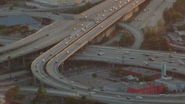 HD stock footage aerial video interchange between the 110 and 10 freeways at sunset in Downtown Los Angeles, California Aerial Stock Footage | HDA06_35