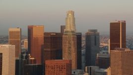 HD stock footage aerial video approach skyscrapers at sunset in Downtown Los Angeles while zooming out, California Aerial Stock Footage | HDA06_40