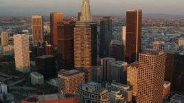 HD stock footage aerial video fly over Downtown Los Angeles past Figueroa at Wilshire and CityNational Plaza at sunset, California Aerial Stock Footage | HDA06_41