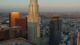 HD stock footage aerial video approach US Bank Tower and Gas Company Tower at sunset in Downtown Los Angeles, California Aerial Stock Footage | HDA06_42