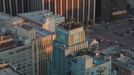 HD stock footage aerial video orbit the Eastern Columbia Building to reveal the Orpheum Theater at sunset, Downtown Los Angeles, California Aerial Stock Footage | HDA06_49