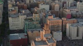 HD stock footage aerial video flyby Eastern Columbia Building and Orpheum Theater to reveal Broadway at sunset, Downtown Los Angeles, California Aerial Stock Footage | HDA06_51