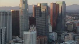 HD stock footage aerial video tilt from Eastern Columbia Building to reveal and approach skyscrapers in Downtown Los Angeles, California at sunset Aerial Stock Footage | HDA06_52