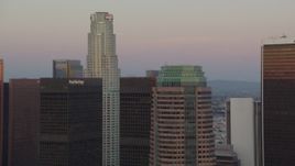 HD stock footage aerial video US Bank Tower and skyscrapers at twilight in Downtown Los Angeles, California and zoom to wider view Aerial Stock Footage | HDA06_58