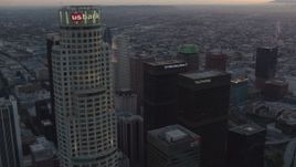 HD stock footage aerial video orbit top of US Bank Tower to reveal other skyscrapers in Downtown Los Angeles, California at twilight Aerial Stock Footage | HDA06_62