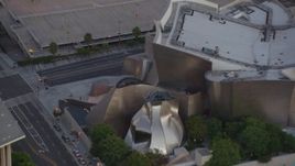 HD stock footage aerial video orbit Walt Disney Concert Hall, tilt to reveal skyscrapers in Downtown Los Angeles, California at twilight Aerial Stock Footage | HDA06_72