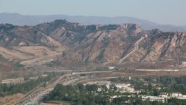 HD stock footage aerial video of the Los Angeles Aqueduct and mountains in San Fernando Valley, California Aerial Stock Footage | HDA07_05