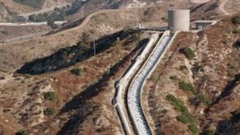 HD stock footage aerial video of approaching the top of the Los Angeles Aqueduct; San Fernando Valley, California Aerial Stock Footage | HDA07_09