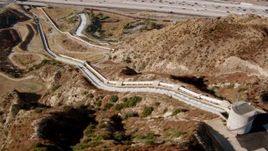 HD stock footage aerial video flying over the Los Angeles Aqueduct to reveal I-5, San Fernando Valley, California Aerial Stock Footage | HDA07_11