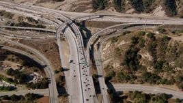 HD aerial stock footage video of a reverse view of Newhall Pass, Santa Clarita, California Aerial Stock Footage | HDA07_14