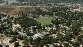 HD aerial stock footage video of fly over homes to baseball field, Newhall, California Aerial Stock Footage | HDA07_25