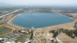 HD stock footage aerial video approach and fly over the Los Angeles Reservoir, Granada Hills, California Aerial Stock Footage | HDA07_34