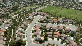 HD stock footage aerial video of flying over homes and park in Sylmar, California Aerial Stock Footage | HDA07_39