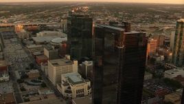 HD aerial stock footage video of flyby by skyscrapers at sunset to reveal high-rise hotel in Downtown Fort Worth, Texas Aerial Stock Footage | HDA12_005