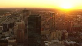 HD stock footage aerial video flyby skyscrapers with setting sun in distance in Downtown Fort Worth, Texas Aerial Stock Footage | HDA12_007