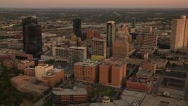 HD stock footage aerial video of a reverse view of skyscrapers at sunset in Downtown Fort Worth, Texas Aerial Stock Footage | HDA12_014