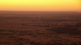HD stock footage aerial video of flying by farmland and rural homes at sunrise, Decatur, Texas Aerial Stock Footage | HDA12_024