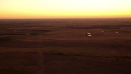 HD stock footage aerial video pass rural homes and farm fields at sunrise in Decatur, Texas Aerial Stock Footage | HDA12_027