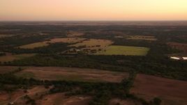 HD stock footage aerial video of a wide view of farmland at sunrise, Decatur, Texas Aerial Stock Footage | HDA12_031