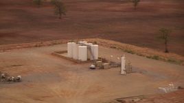 HD stock footage aerial video of small farm silos at sunrise in Decatur, Texas Aerial Stock Footage | HDA12_036