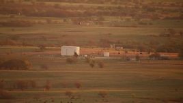 HD stock footage aerial video of a large tank and farmland at sunrise, Red River, Texas Aerial Stock Footage | HDA12_052