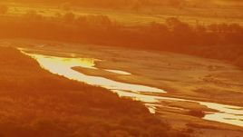 HD stock footage aerial video of Red River at sunrise, and oil rigs on the Texas side of the border Aerial Stock Footage | HDA12_055