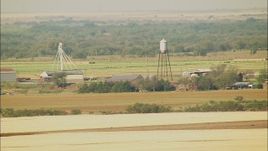 HD stock footage aerial video of a farm with a water tower in Walters, Oklahoma Aerial Stock Footage | HDA12_089
