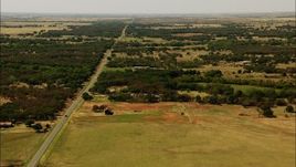 HD stock footage aerial video flyby country road, rural homes, farmland in Temple, Oklahoma Aerial Stock Footage | HDA12_105