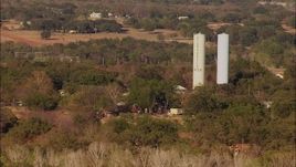 HD stock footage aerial video of tall silos, rural homes and trees in Meridian, Oklahoma Aerial Stock Footage | HDA12_123