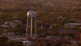 HD stock footage aerial video of a water tower and small town at sunset, Nocona, Texas Aerial Stock Footage | HDA12_151