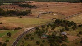 HD stock footage aerial video of flying over Highway 380 through Decatur, Texas, sunset Aerial Stock Footage | HDA12_169