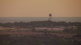 HD stock footage aerial video of a water tower at sunset in a small town, Decatur, Texas Aerial Stock Footage | HDA12_171