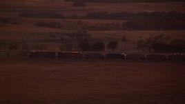HD stock footage aerial video of a train passing through countryside at night in Decatur, Texas Aerial Stock Footage | HDA12_180