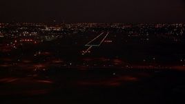 HD stock footage aerial video approach the Fort Worth Meacham International Airport runway at night, Texas Aerial Stock Footage | HDA12_186