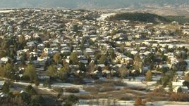 HD aerial stock footage video of flying over homes and snowy fields in Castle Pines, Colorado Aerial Stock Footage | HDA13_278