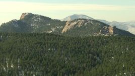 HD stock footage aerial video of flying by Rocky Mountains with forest and snow in Colorado Aerial Stock Footage | HDA13_287